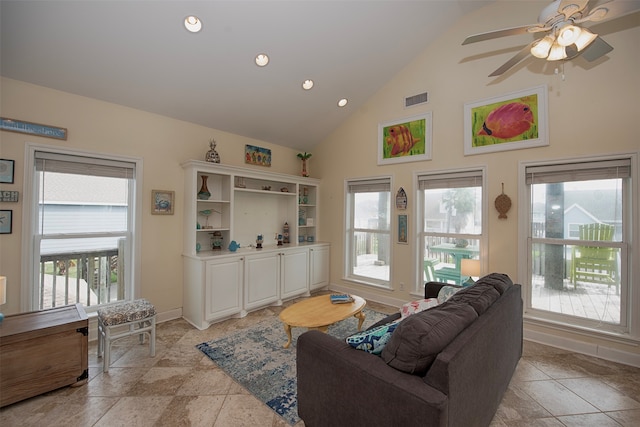 living room with high vaulted ceiling, ceiling fan, and light tile floors