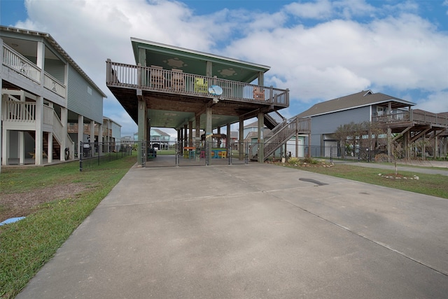 rear view of house featuring a yard