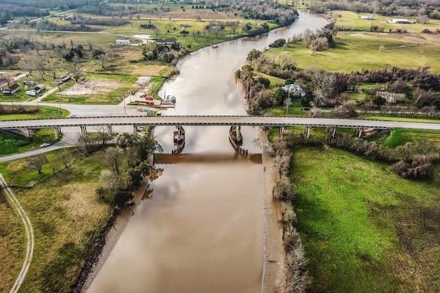 birds eye view of property with a rural view and a water view