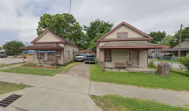 view of front of home featuring a front yard and covered porch