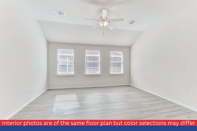 unfurnished room featuring lofted ceiling, light hardwood / wood-style floors, and ceiling fan