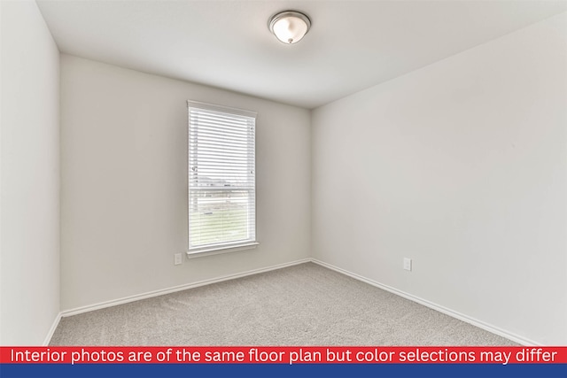 spare room featuring light carpet and a wealth of natural light