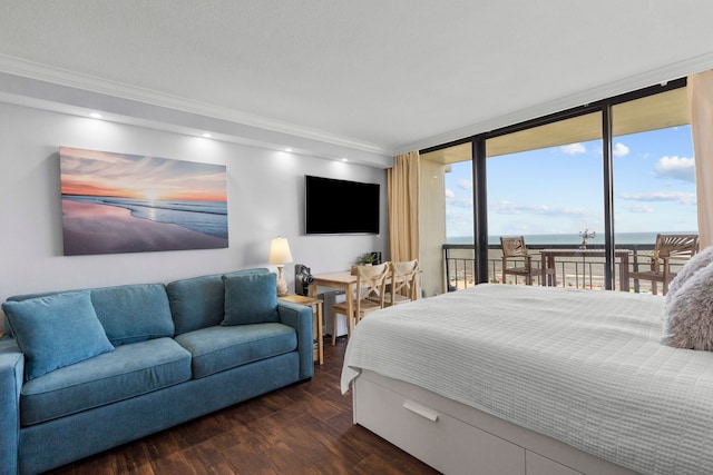 bedroom with access to exterior, floor to ceiling windows, dark hardwood / wood-style flooring, ornamental molding, and a water view