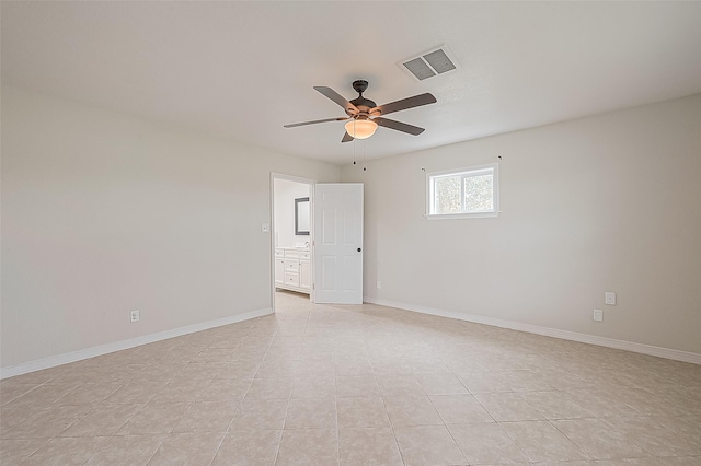 spare room with light tile patterned flooring and ceiling fan