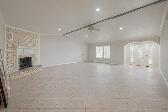 unfurnished living room with light tile patterned flooring, ceiling fan, vaulted ceiling, and crown molding