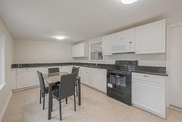 kitchen featuring sink, black / electric stove, and white cabinets