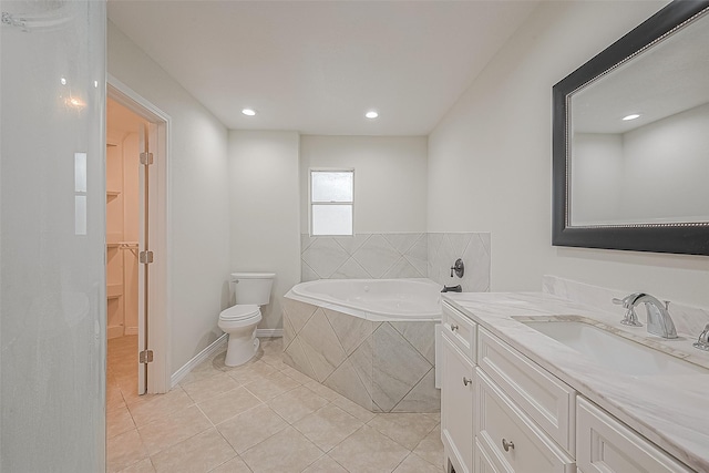 bathroom featuring toilet, tiled tub, tile patterned floors, and vanity