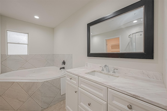 bathroom with vanity, tile patterned flooring, and separate shower and tub