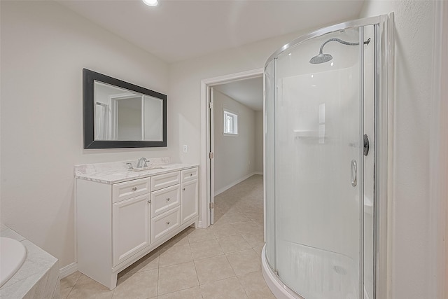 bathroom with vanity, tile patterned floors, and plus walk in shower