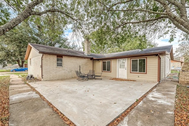 rear view of property with a patio area