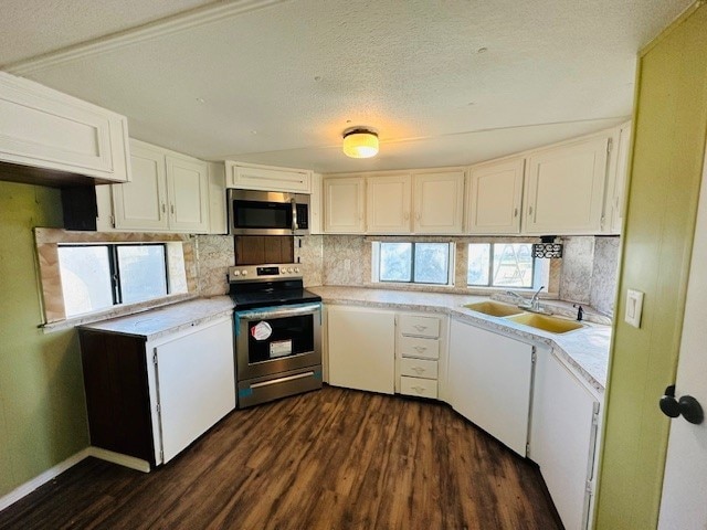 kitchen featuring white cabinetry and appliances with stainless steel finishes