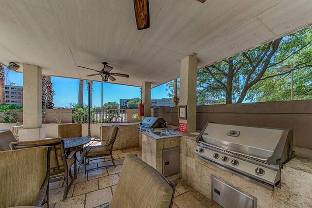 view of patio / terrace featuring ceiling fan, grilling area, and an outdoor kitchen