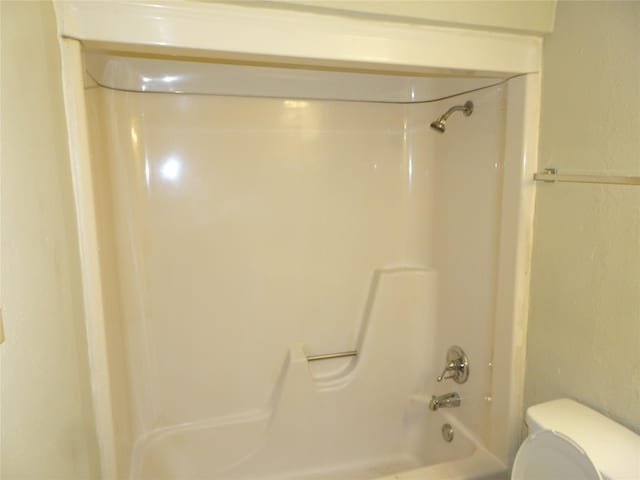 bathroom with  shower combination and toilet