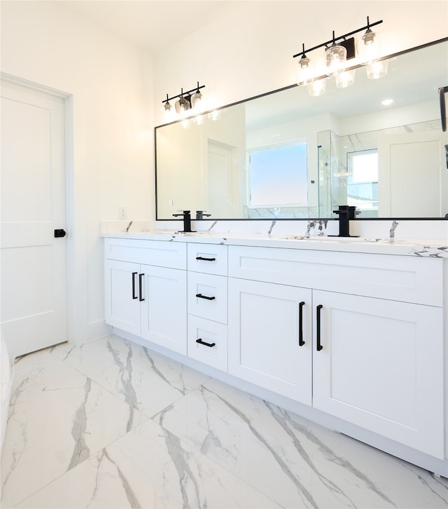 bathroom with walk in shower and vanity