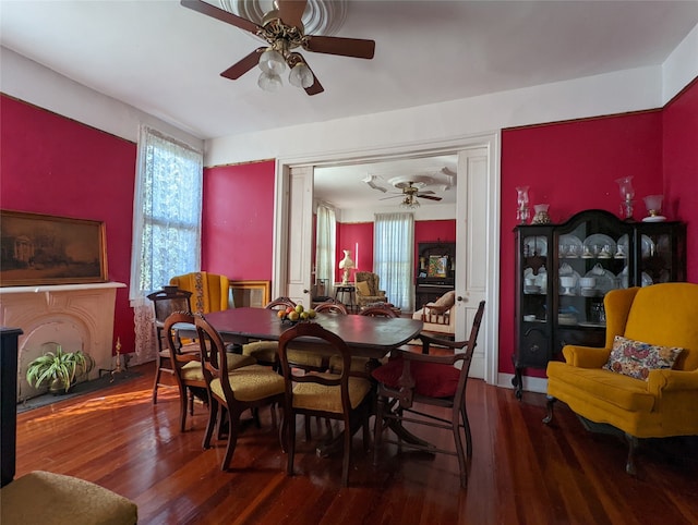 dining area with hardwood / wood-style floors and ceiling fan