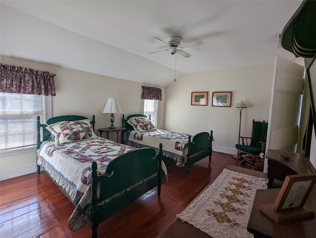 bedroom featuring ceiling fan, lofted ceiling, and dark hardwood / wood-style floors