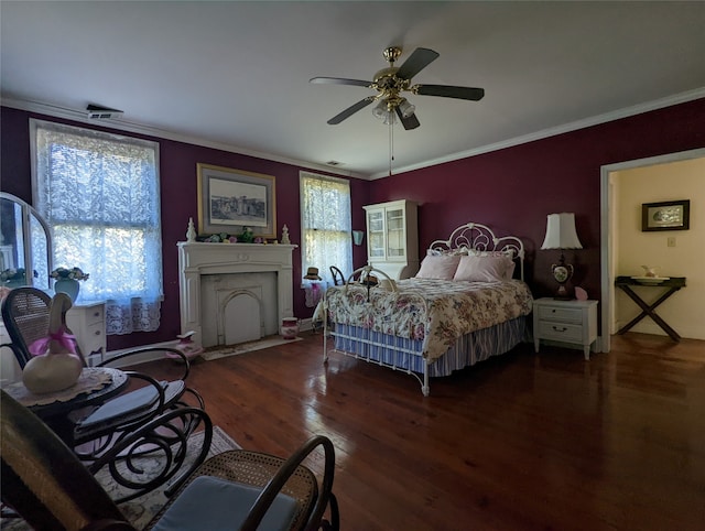 bedroom featuring dark hardwood / wood-style flooring, crown molding, multiple windows, and ceiling fan