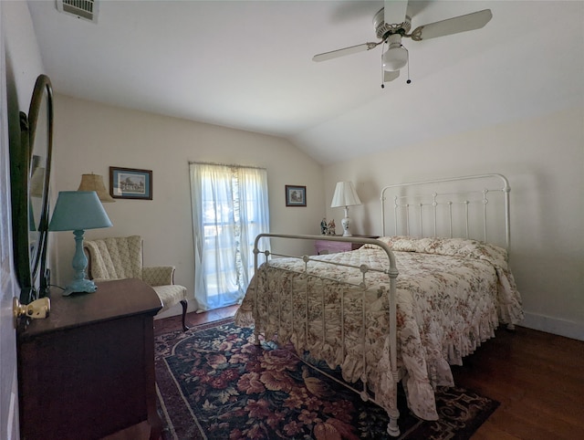 bedroom with ceiling fan, lofted ceiling, and dark hardwood / wood-style flooring