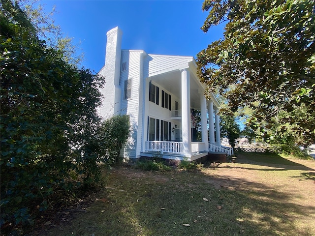 view of home's exterior featuring a yard