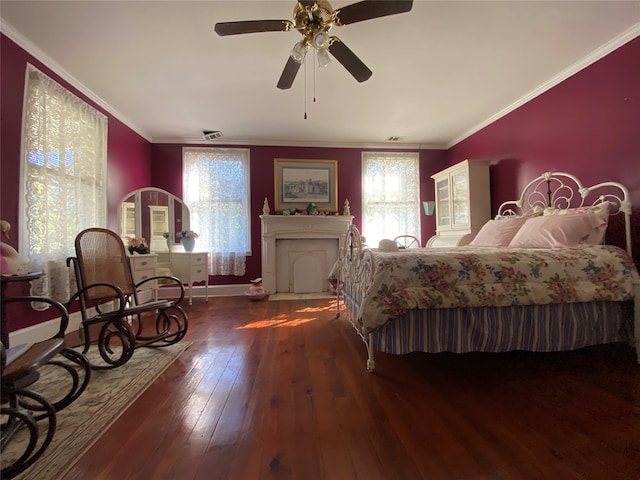 bedroom with ceiling fan, crown molding, and dark hardwood / wood-style floors