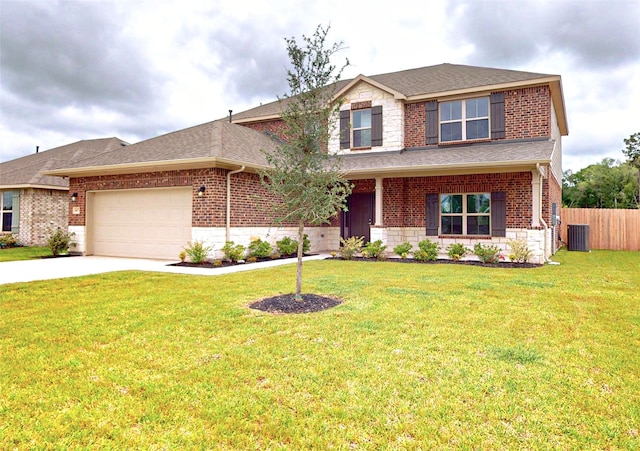 view of front of property with a front lawn, a garage, and central AC unit