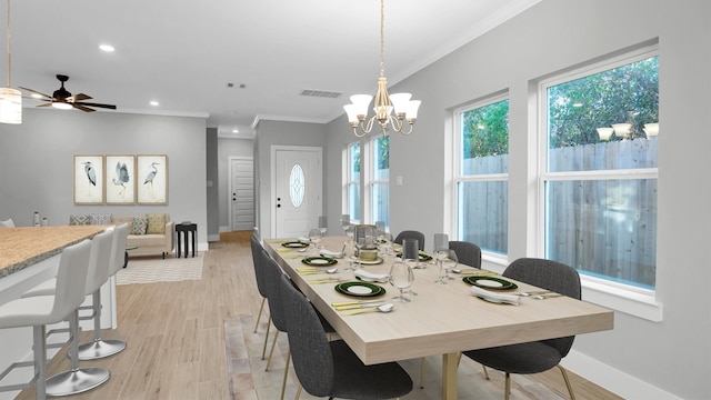 dining room featuring ceiling fan with notable chandelier, light hardwood / wood-style floors, and ornamental molding