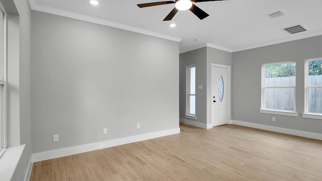 interior space with ceiling fan, light hardwood / wood-style floors, and ornamental molding