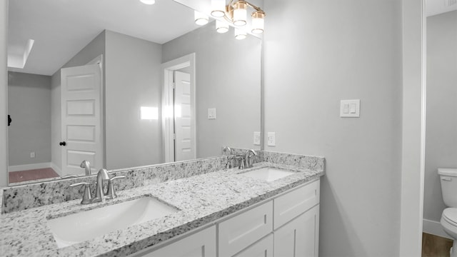 bathroom with vanity and toilet