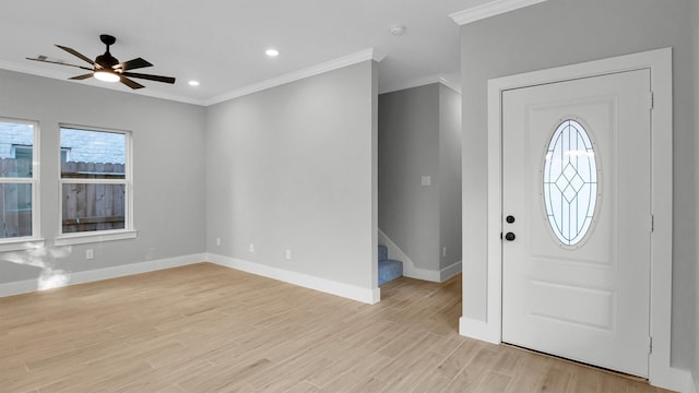 entryway featuring light hardwood / wood-style floors, ceiling fan, and crown molding