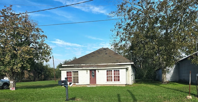 view of outbuilding featuring a yard