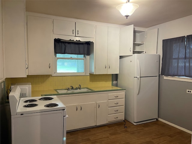 kitchen with white appliances, sink, white cabinetry, and dark hardwood / wood-style flooring