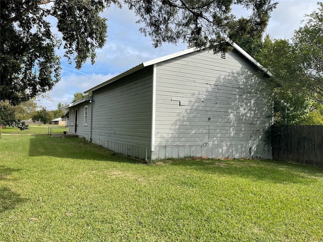 view of home's exterior featuring a yard