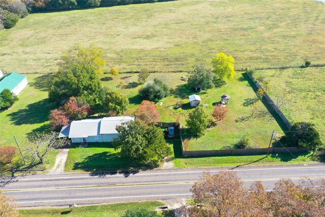 birds eye view of property featuring a rural view