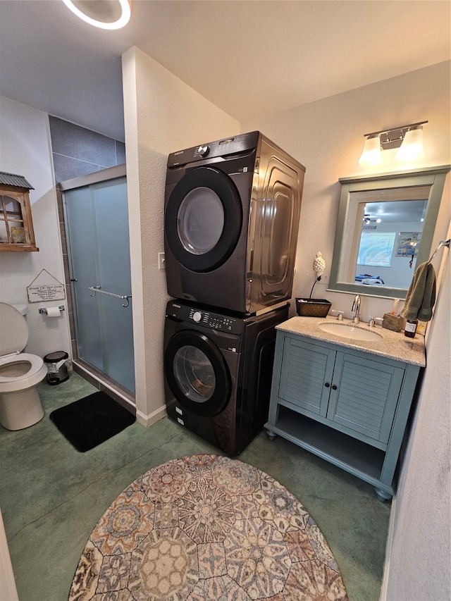 washroom with sink, stacked washing maching and dryer, and dark colored carpet