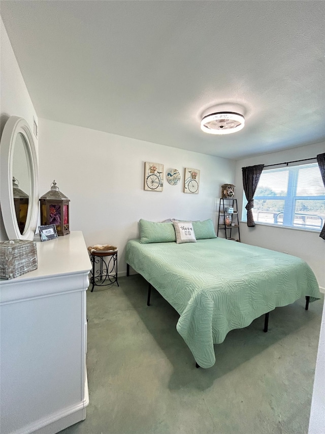 carpeted bedroom featuring a textured ceiling