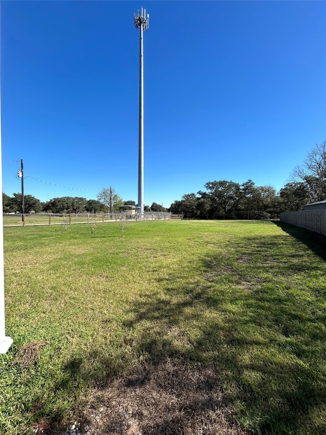 view of yard with a rural view