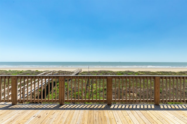 wooden deck with a water view