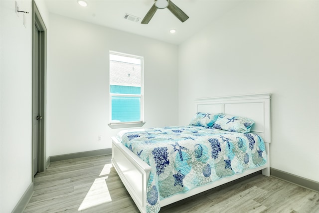 bedroom featuring light hardwood / wood-style floors and ceiling fan