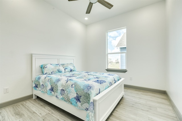 bedroom featuring ceiling fan and light wood-type flooring