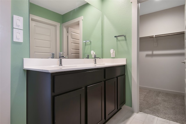 bathroom with tile patterned floors and vanity