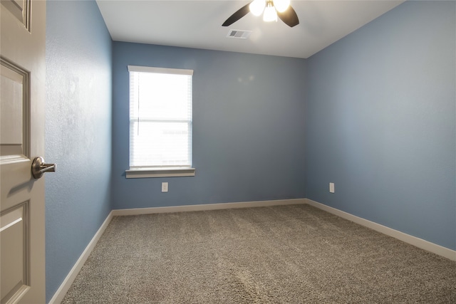 carpeted empty room featuring ceiling fan