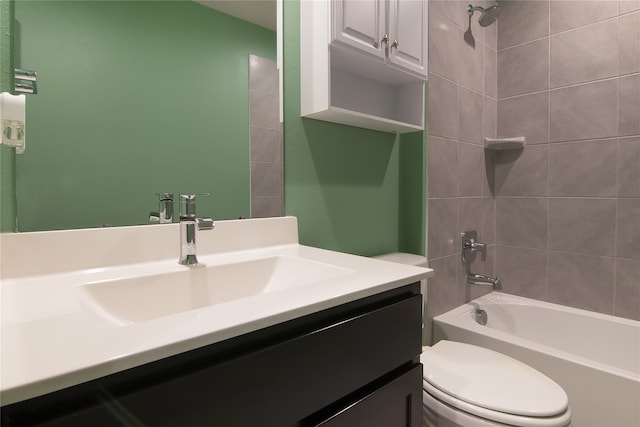 full bathroom with vanity, toilet, and tiled shower / bath