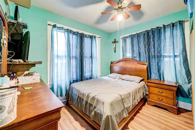 bedroom featuring ceiling fan and light wood-type flooring