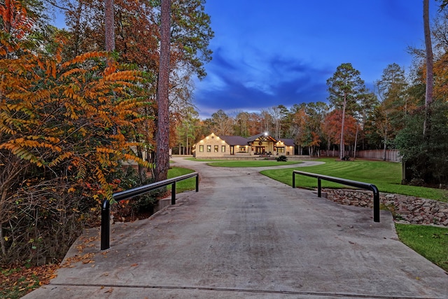 view of property's community with a yard