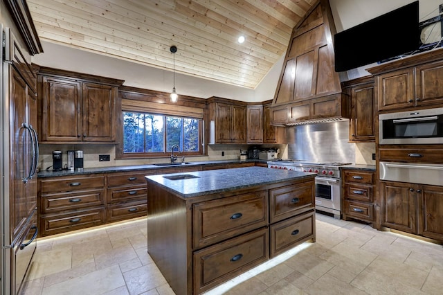 kitchen featuring high end appliances, tasteful backsplash, decorative light fixtures, high vaulted ceiling, and a kitchen island