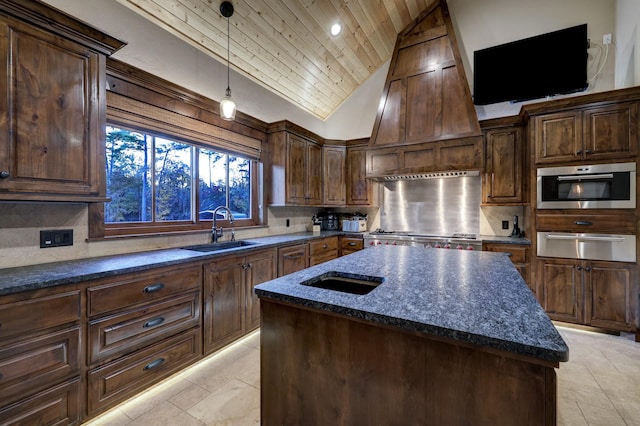 kitchen with lofted ceiling, sink, a center island, custom range hood, and decorative backsplash