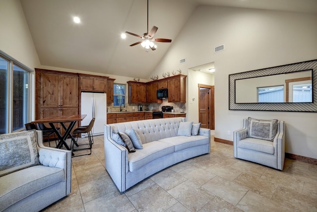 living room with sink, high vaulted ceiling, and ceiling fan