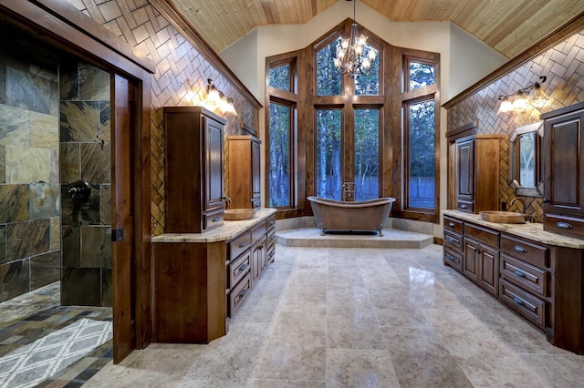 bathroom with wood ceiling, an inviting chandelier, high vaulted ceiling, vanity, and a tub