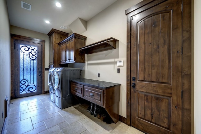 laundry room with cabinets and independent washer and dryer