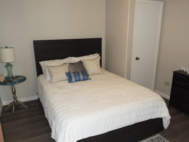 bedroom featuring dark wood-type flooring